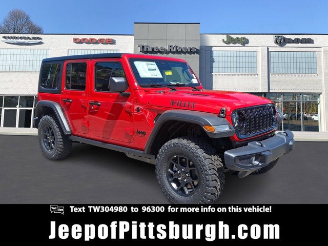 2026 Jeep Wrangler WRANGLER 4-DOOR WILLYS in Firecracker Red Clear-Coat Exterior Paint — front three-quarter view