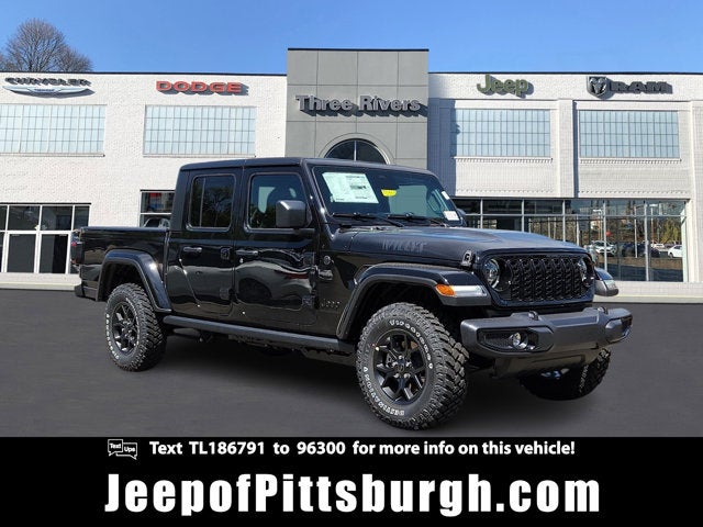 2026 Jeep Gladiator GLADIATOR WILLYS 4X4 in Black Clear-Coat Exterior Paint — front three-quarter view