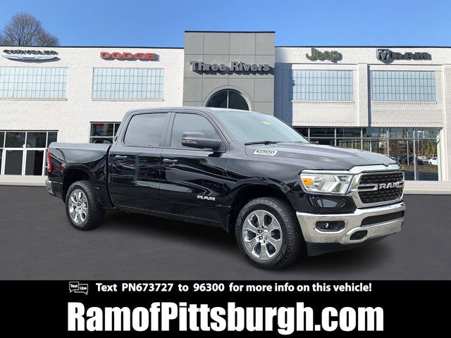2023 RAM 1500 Big Horn Crew Cab 4x4 5'7' Box in Diamond Black Crystal Pearlcoat — front three-quarter view