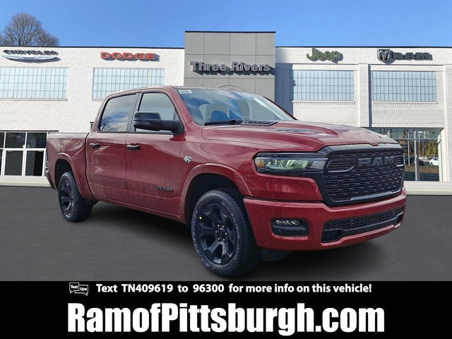 2026 RAM 1500 RAM 1500 BIG HORN CREW CAB 4X4 5'7' BOX in Molten Red Pearl-Coat Exterior Paint — front three-quarter view