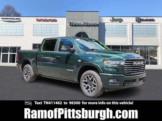 2026 RAM 1500 RAM 1500 LARAMIE CREW CAB 4X4 5'7' BOX in Serrano-Green Metallic Exterior Paint — front three-quarter view