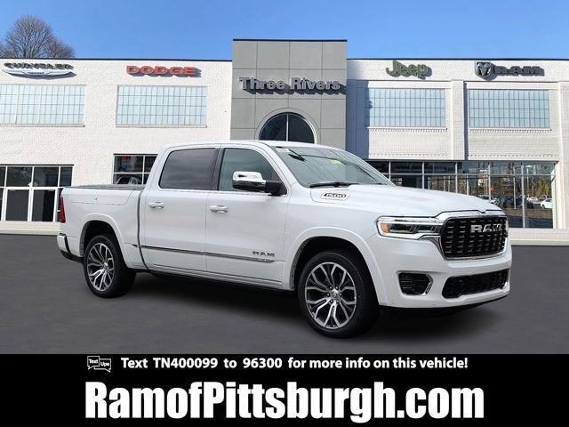 2026 RAM 1500 RAM 1500 TUNGSTEN CREW CAB 4X4 in Ivory White Tri-Coat Pearl-Coat Exterior Paint — front three-quarter view