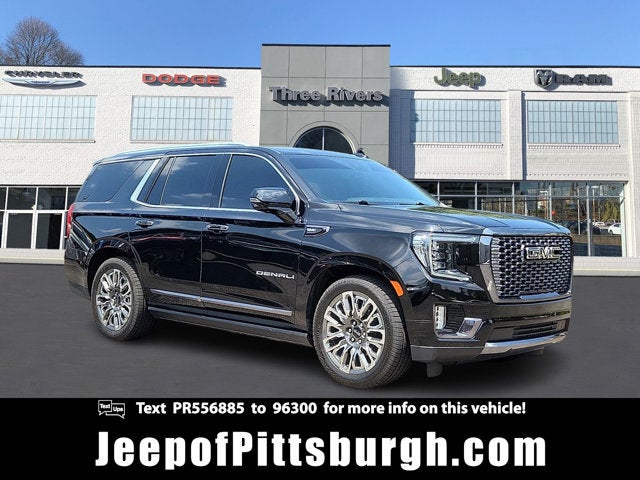 2023 GMC Yukon 4WD Denali Ultimate in Onyx Black — front three-quarter view