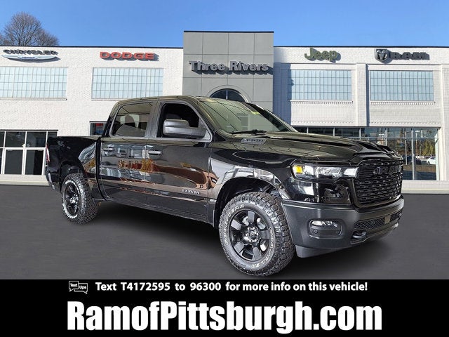 2026 RAM 1500 RAM 1500 WARLOCK CREW CAB 4X4 5'7' BOX in Diamond Black Crystal Pearl-Coat Exterior Paint — front three-quarter view