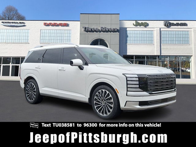 2026 Hyundai Palisade Hybrid Calligraphy in Creamy White Pearl — front three-quarter view